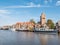 Boats, houses and church tower in town of Grou, Friesland, Netherlands