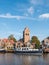 Boats, houses and church tower in town of Grou, Friesland, Netherlands