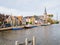 Boats and houses on quay of Ee canal in village of Woudsend in Friesland, Netherlands