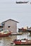 Boats and hut with poor living