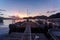 Boats at long docks at sunset