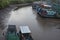 Boats on low tide river in Ben Tre.