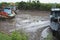 Boats on low tide river in Ben Tre.