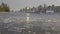 Boats in Marina, Coal Harbour, Urban City Skyline and Ice on water during Winter Season. Seawall in Stanley Park.