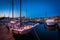 Boats in a marina at twilight, in Fells Point, Baltimore, Maryland.