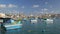 Boats In Marsaxlokk Fishing Village In Malta