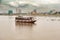 Boats on the Mekong river and the Phnom Penh skyline at the back