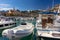 Boats in Menton harbor and the Basilique Saint-Michel, France, E