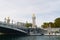 Boats moored at the foot of the Pont d`Alexandre III on the River Seine