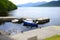 Boats moored harbour harbour stone pier jetty water two miniature scenic view landscape loch Lomond Inversnaid Scotland