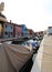 Boats moored in the navigable canal of Burano island near Venice