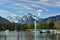 Boats moored on the Walensee lake. Snow-capped Alps. Village of Weesen, Switzerland