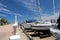 Boats moored at the yacht club pier