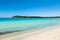 Boats mooring in the turquoise water of Rondinara beach in Cors