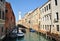 Boats on narrow canal,Venice