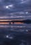 Boats in the navigable freshwater reservoir in Extremadura, Embalse Gabriel y Galan vertically at sunset