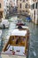 Boats navigating canal in Venice