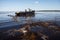 boats navigating through toxic waters left by oil spills