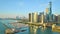 Boats at Navy Pier on lake at sunrise, aerial Chicago coastline with downtown skyscrapers, IL