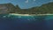 Boats on ocean bay aerial view at sand beach. Tropical forest on mountainous island El Nido, Palawan