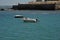 Boats off the coast of Cadiz near the fortress of Castillo Fortaleza de Santa Catalina.