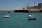 Boats off the coast of Cadiz near the fortress of Castillo Fortaleza de Santa Catalina.