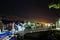 Boats parked at marina at night