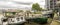 Boats parked near residential blocks and Nine Elm Elms tavern on southbank of river Thames near Battersea, London