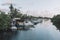 Boats parking in water. Boats docked in river under blue sky cloudy in summer