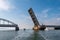 Boats passing Oddesund Bridge over Oddesund Strait in Limfjord, Midtjylland, Denmark