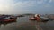 Boats on pier sangam conclusion of three holy rivers Kumbha Mela Allahabad 2019 blue sky