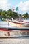 Boats at Playa Pescadores with boats and local flag at Tulum, Mexico