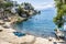 Boats pulled up on beach & volcano behind, San Antonio Palapo, Lake Atitlan, Guatemala