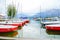 Boats ready for hire and waiting tied to pier on pcturesque Lake