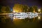 Boats reflected in France Canal in middle of the night