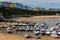 Boats resting on the sand at lowtide in the picturesque harbour and seaside town of Tenby in Wales