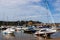 Boats resting on the sand at lowtide in the picturesque harbour and seaside town of Tenby in Wales