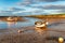 Boats on the river estuary at Burnham Overy Staithe