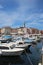 Boats in Rovinj harbor, Croatia with town behind