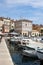 Boats in Rovinj harbor, Croatia with town behind