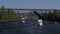 Boats sail under The Fremont Bridge from Lake Union, Seattle, Washington, USA