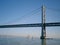 Boats sail under the San Francisco side of Bay Bridge