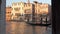 Boats sailing along the canal in Venice. Grand Canal in Venice at sunset.