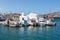 Boats and sailing ship moored at the harbor wharf. Naoussa, Paros Island, Greece