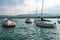 Boats, sailing yachts on lake Zurich, Switzerland. Landscape. View of the opposite bank with houses on the slope