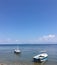 boats on the sea with fisherman