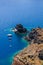 Boats in the sea near the coast of Oia village on Santorini island