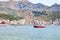 Boats in sea near waterfront of Giardini Naxos