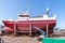 Boats and ships getting a fresh paint job in the shipyard at the harbor