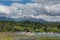 Boats on the shore of Lake Villarrica with the volcano of the same name, Pucon, Chile